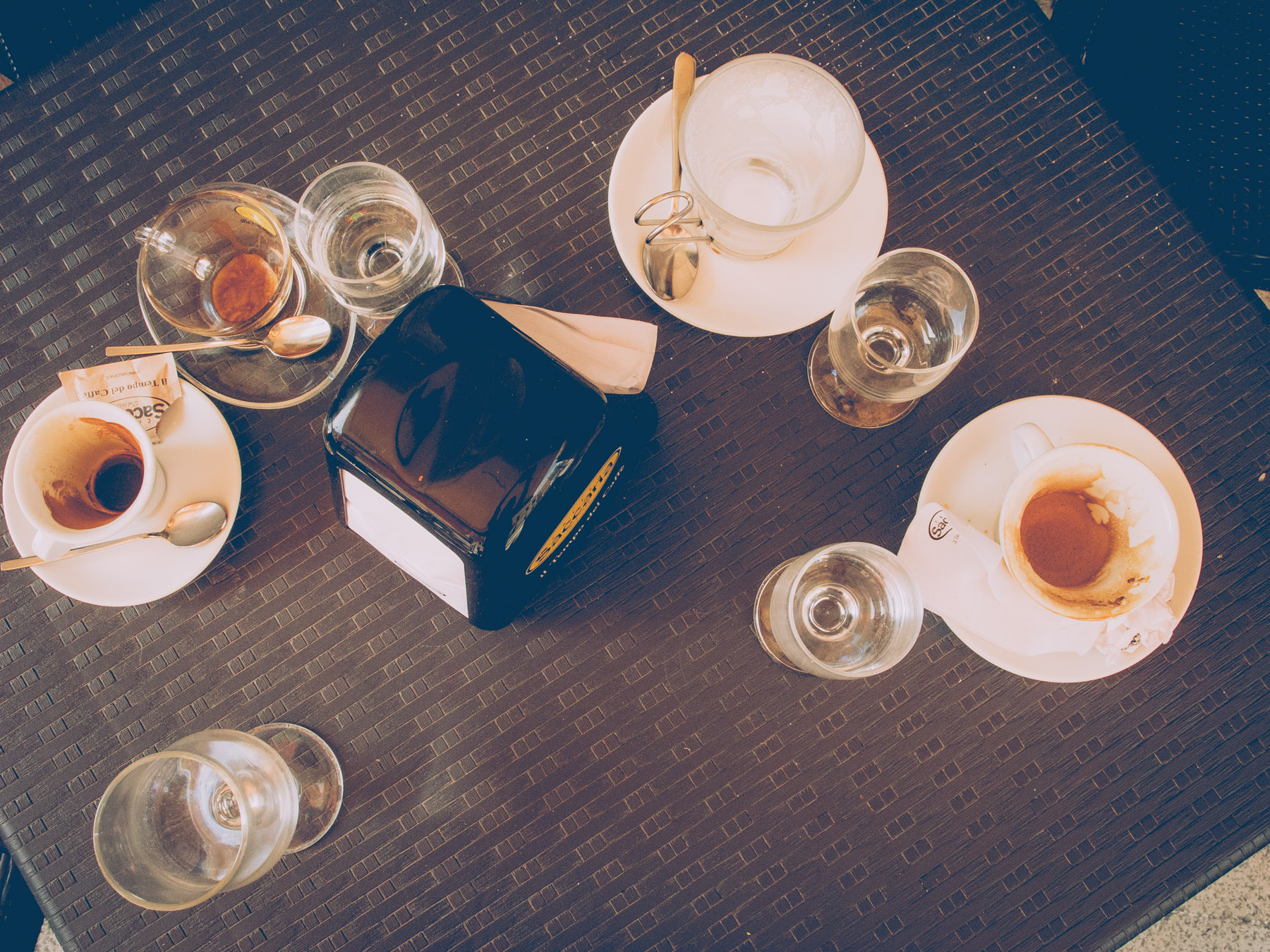 leftovers of coffee and glasses on a bar table in barletta